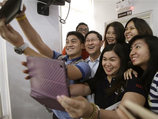 The Filipino selfie. In the Philippines, people are obsessed with cellphones and mobile technology and use selfies as part of social climbing